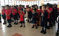 Kindergarten children gathered together in the school hall